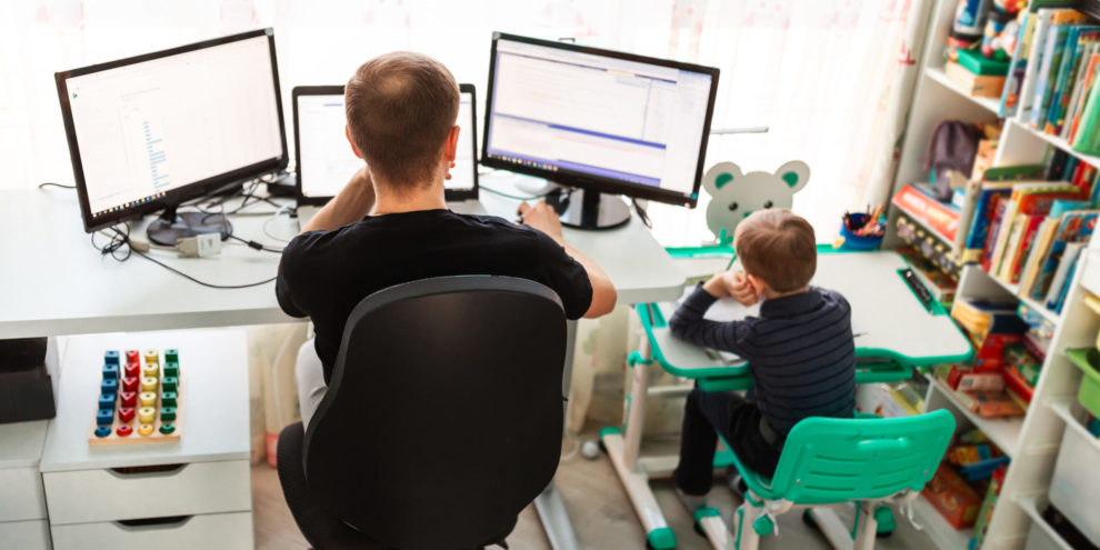 Father with kid working from home during quarantine. Stay at home, work from home concept during coronavirus pandemic 7 tips to help you stay secure when working from home
