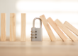 Business Continuity Padlock stopping building blocks falling over