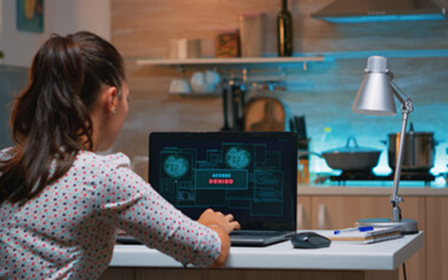 Woman looking at laptop screen